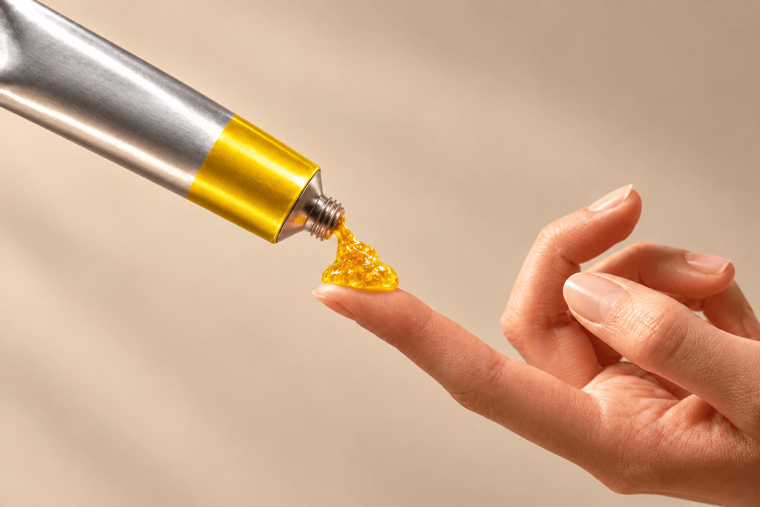 Dabbing the Yuzu Citrus Glow tube onto a fingertip